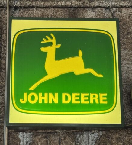 Vintage John Deere lighted advertising sign with leaping deer logo
