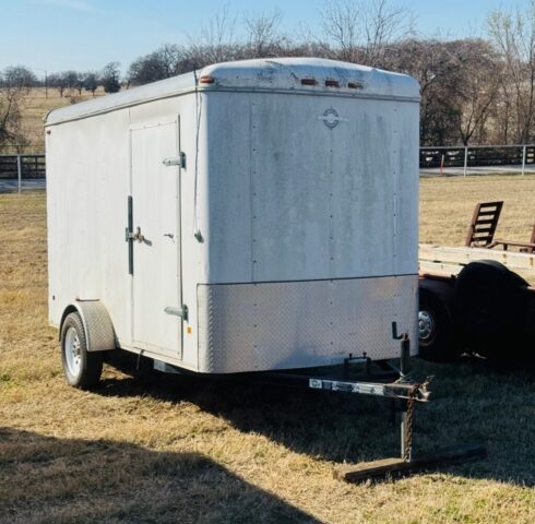 Enclosed cargo trailer in public farm auction offered by Kiefer Auctioneers in Texas