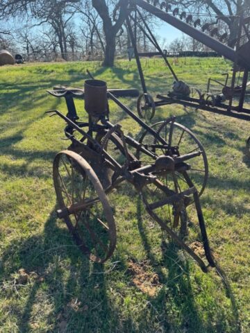 Antique farm equipment in public auction offered by Kiefer Auctioneers in Texas