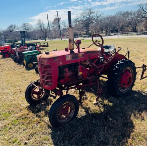 Vintage Farmall tractor in public farm auction offered by Kiefer Auctioneers in Texas