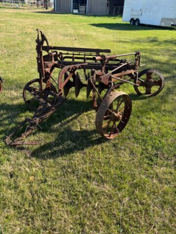 Antique farm equipment for sale in public auction offered by Kiefer Auctioneers in Texas