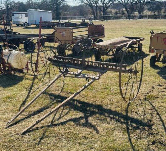 antique horse-drawn dump rake in public farm auction offered by Kiefer Auctioneers in Texas