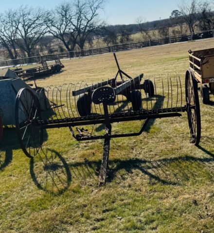 vintage horse-drawn dump rake in public farm auction offered by Kiefer Auctioneers in Texas
