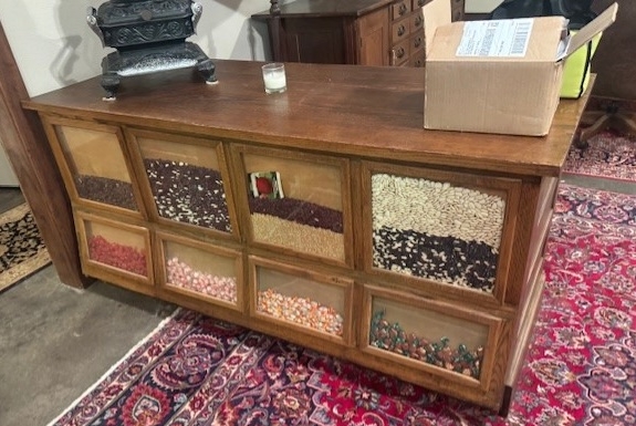 Antique oak bean seed counter cabinet in upcoming online auction offered by Kiefer Auctioneers in Texas