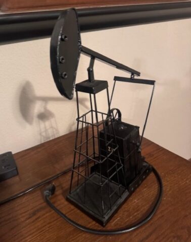 Decorative metal pump jack in upcoming online auction offered by Kiefer Auctioneers in Texas