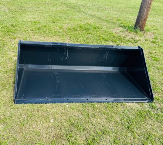 Wolverine skid steer bucket in upcoming public auction offered by Kiefer Auctioneers in Texas