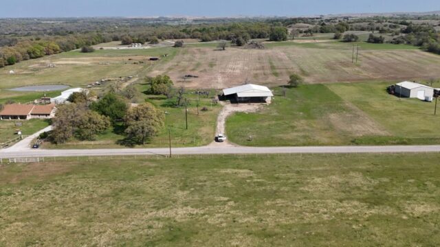 Texas land auction offering 10 acres in Decatur TX with shop, water well, and live onsite auction bidding.