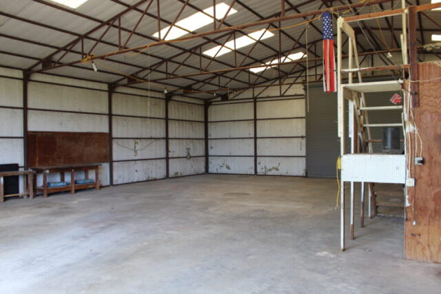 Real estate auction in Decatur Texas featuring 10 acres of land with shop, water well, and auction bidding opportunity.