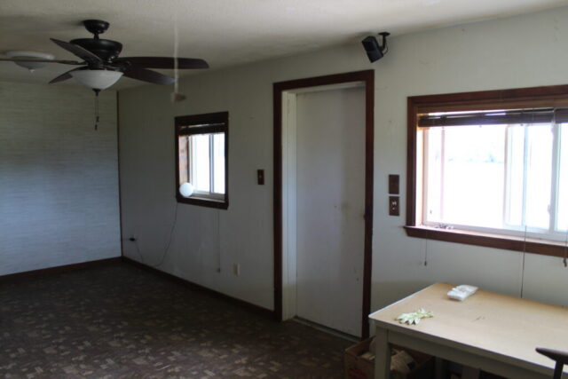 Real estate auction in Decatur Texas featuring 10 acres of land with shop, water well, and auction bidding opportunity.