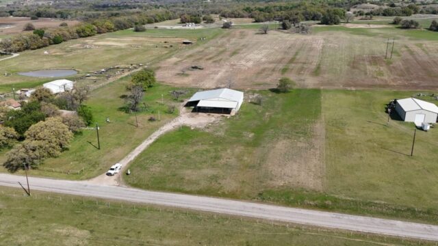 Decatur TX property with shop and water well selling by real estate auction in North Texas.