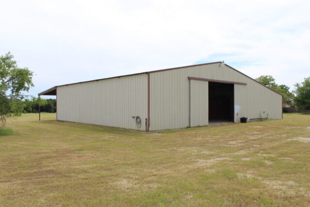 Wise County Texas real estate auction for 10 acres in Decatur with shop, water well, and land opportunity.