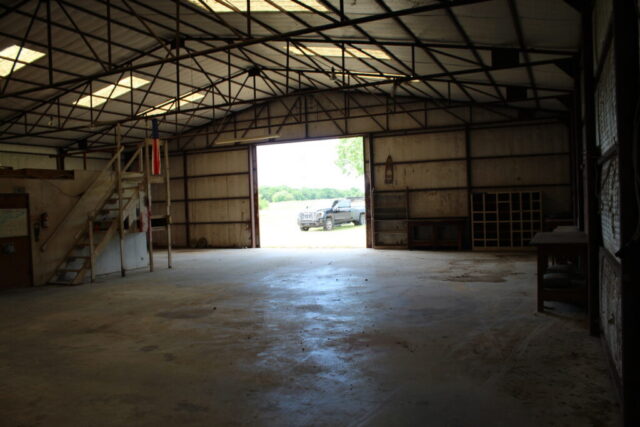 Wise County Texas real estate auction for 10 acres in Decatur with shop, water well, and land opportunity.