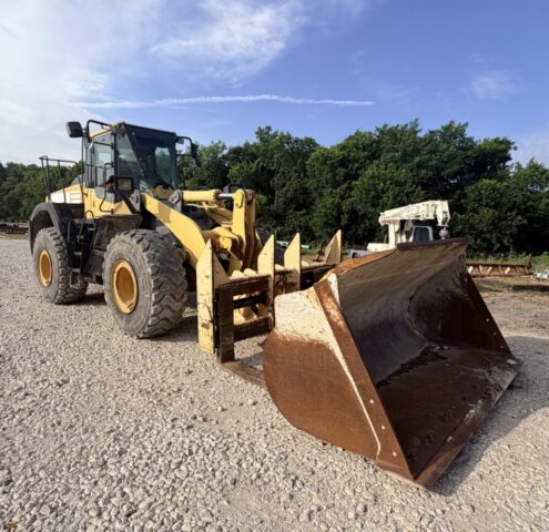 Caterpillar wheel loader equipped with front bucket for sale in upcoming public auction offered by Kiefer Auctioneers in Texas